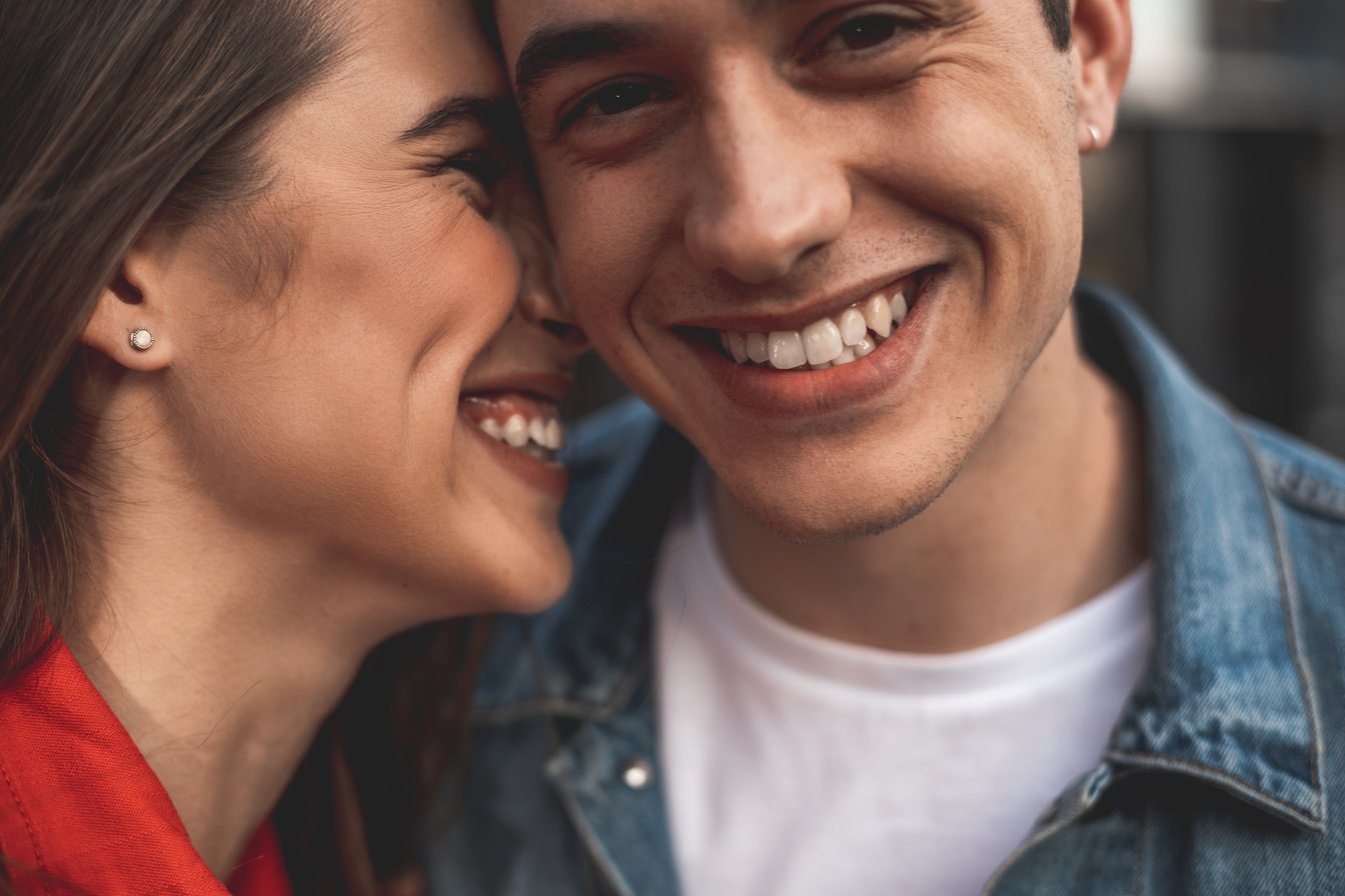 Happy man and woman hugging